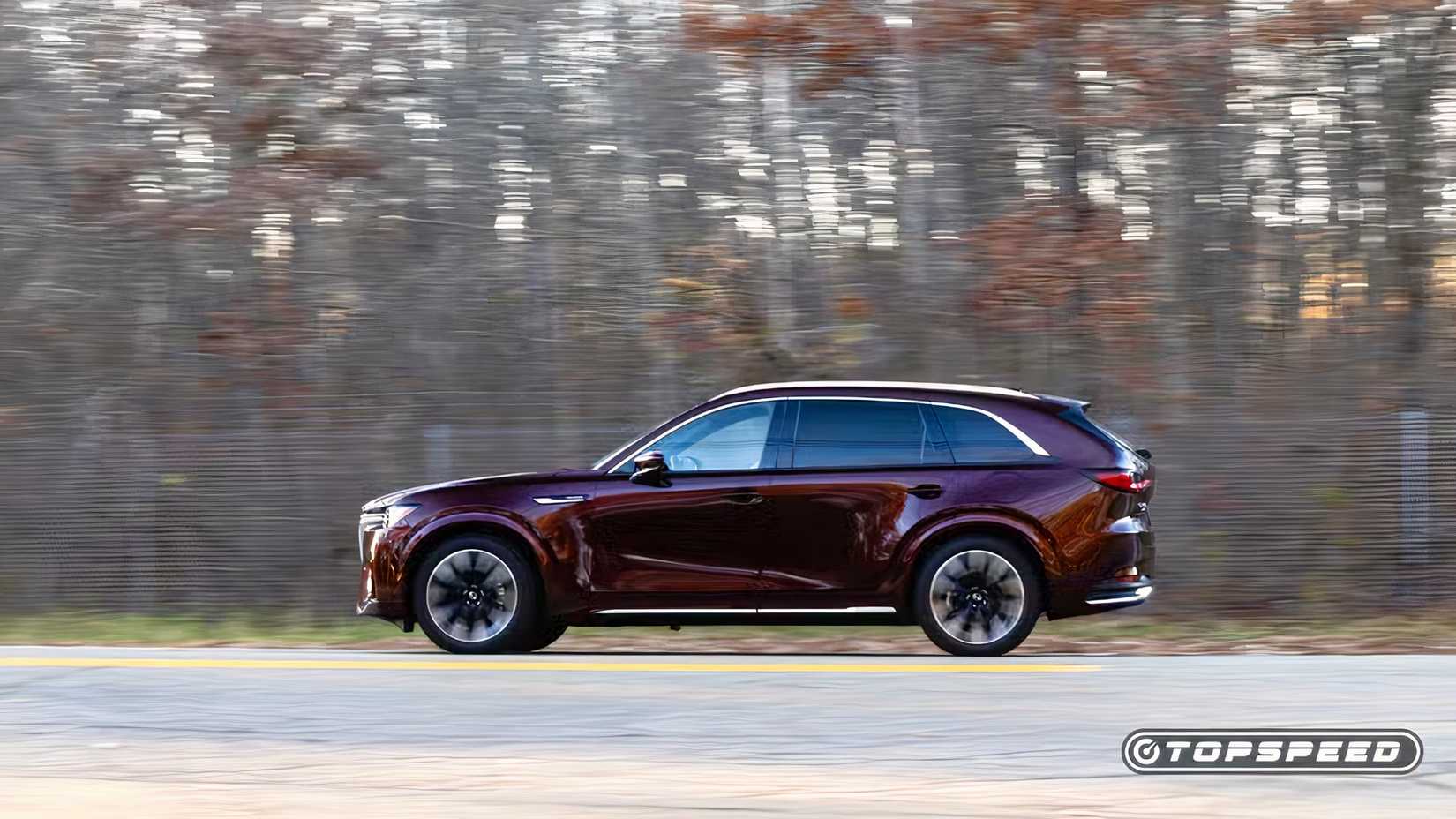 2025 Mazda CX-90 side shot driving down the road