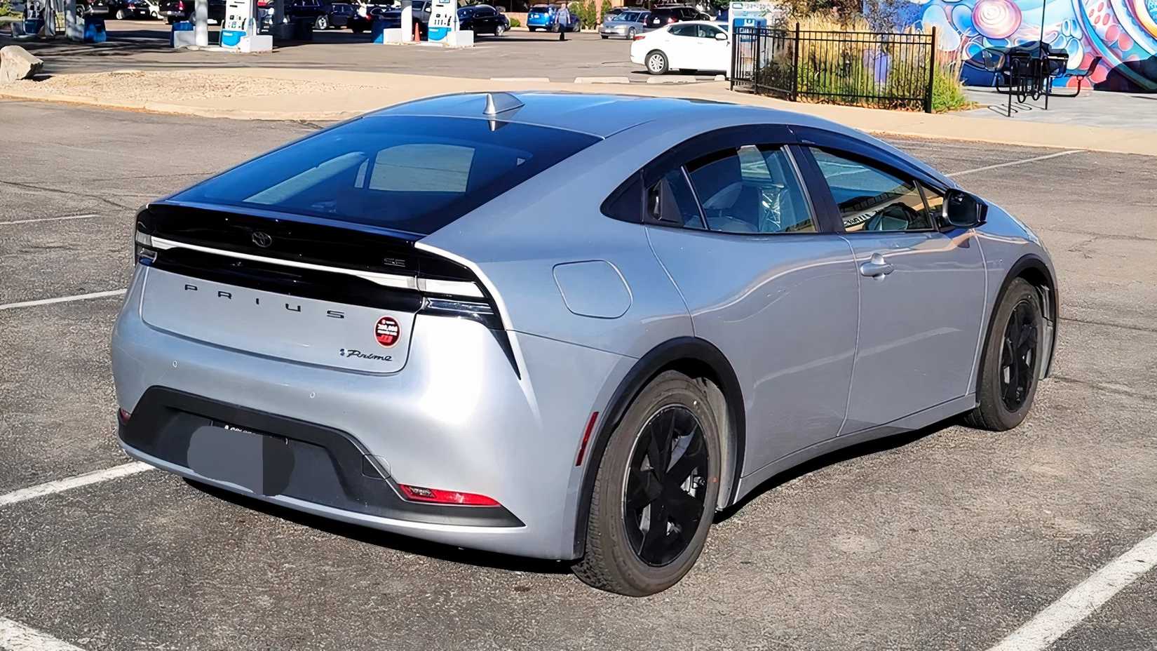Parking lot view of 2023 Prius Prime SE with 200,000 miles.