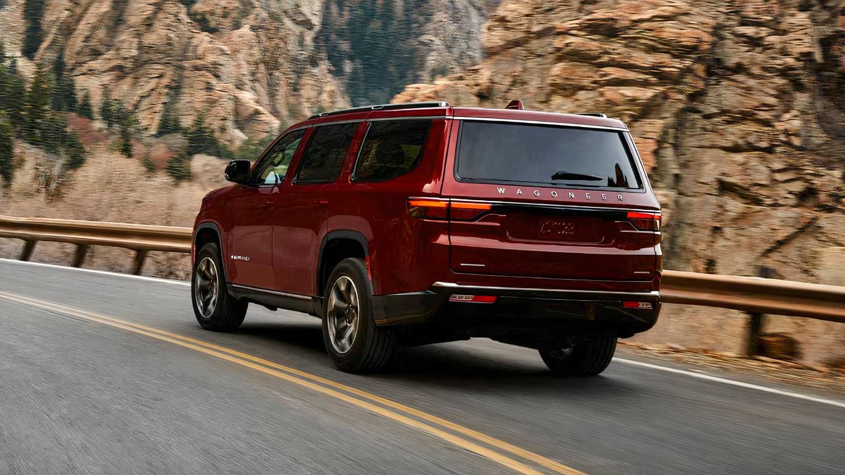 Rear 3/4 shot of 2025 Jeep Wagoneer Front in red being driven