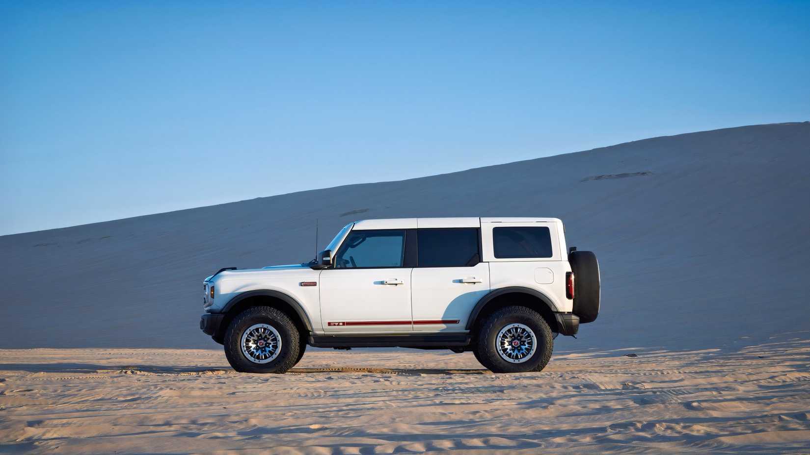 2026 Ford Bronco 60th Anniversary Edition in white driving across desert