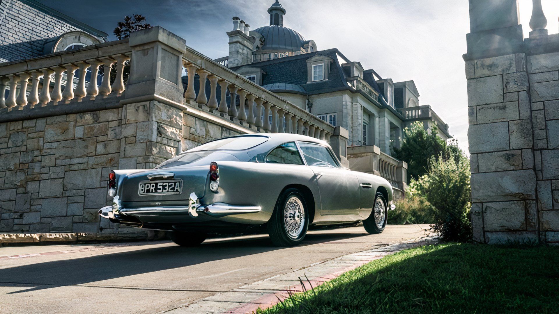 1963 Aston Martin DB5 in silver being driven