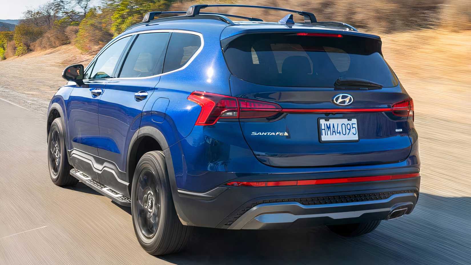 2023 Hyundai Santa Fe XRT in blue being driven