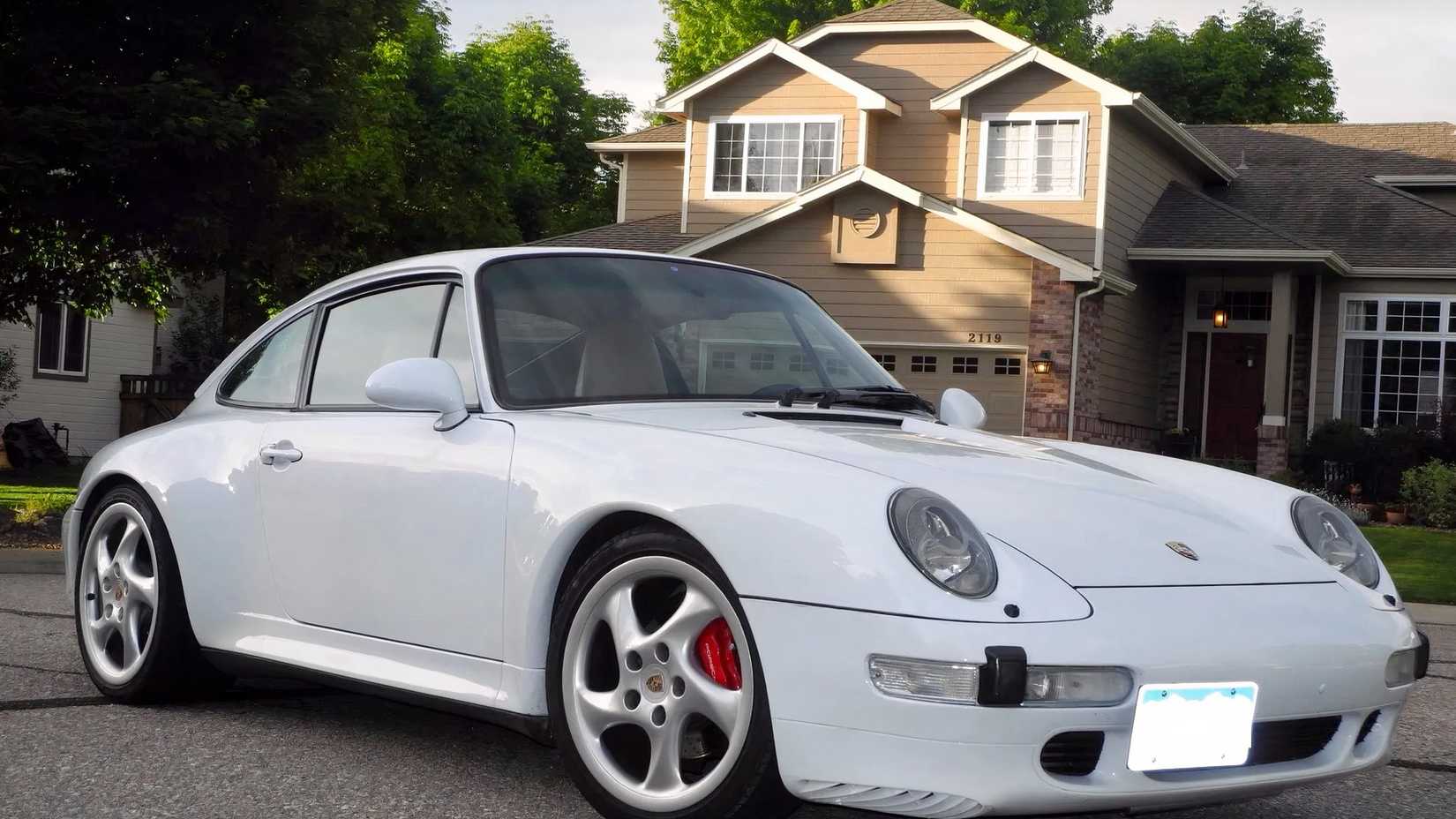 1998 Porsche 911 Carrera S in white parked
