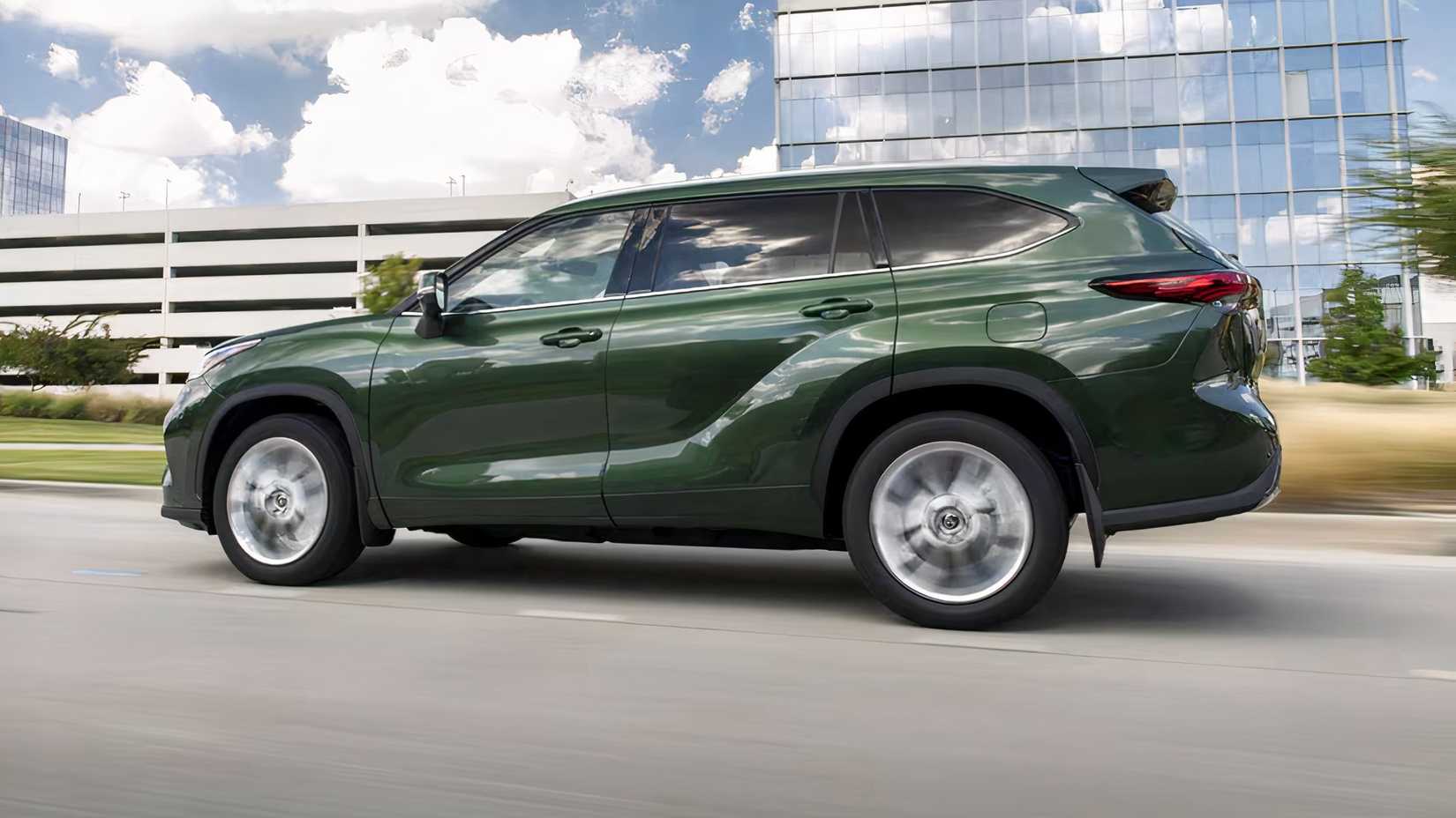 2025 Toyota Highlander Limited in green being driven on road