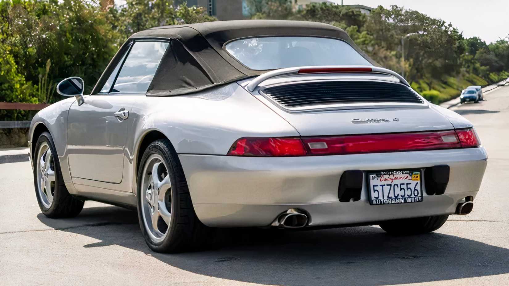 1998 Porsche 911 Carrera 4 Cabriolet in silver parked