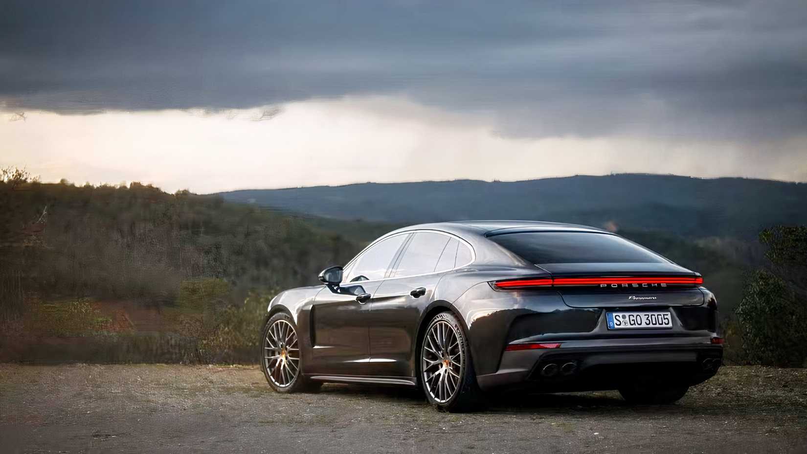 2025 Porsche Panamera in black parked off-road