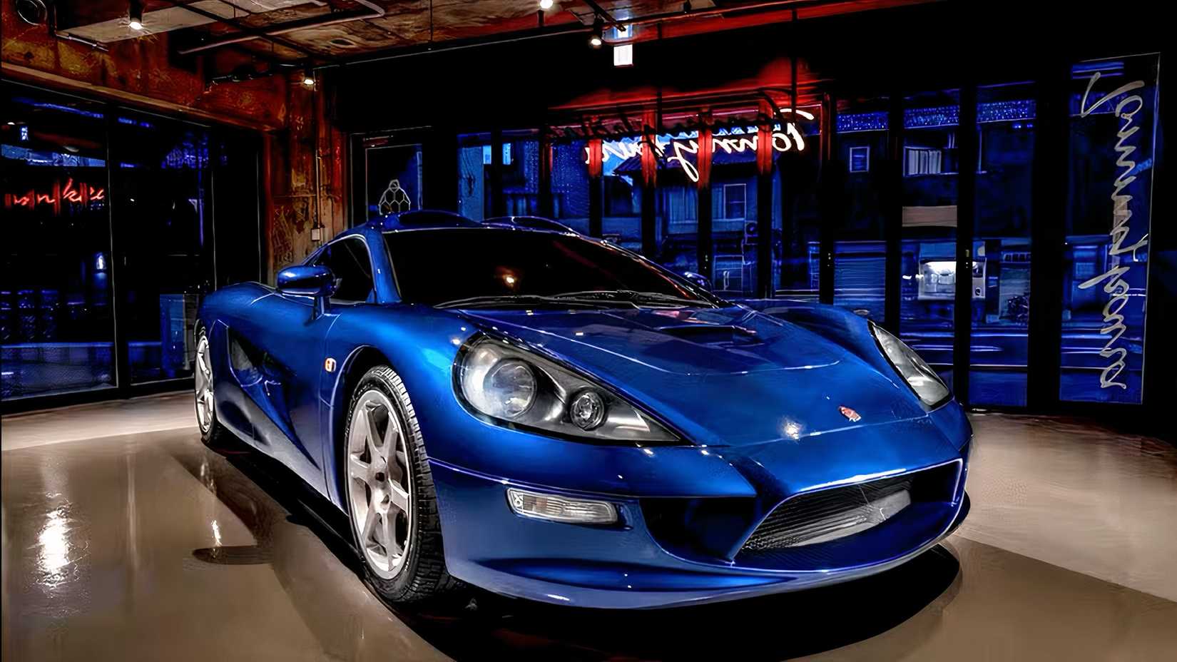 Tommykaira ZZ II in blue parked inside