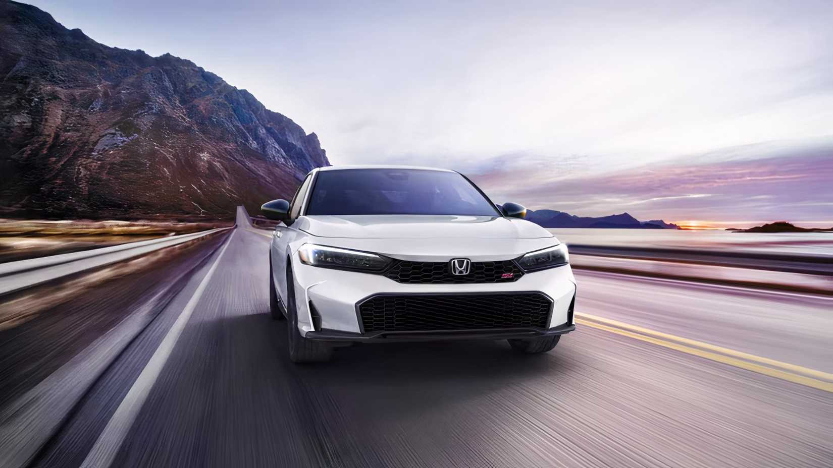 2025 Honda Civic Si in white being driven on road