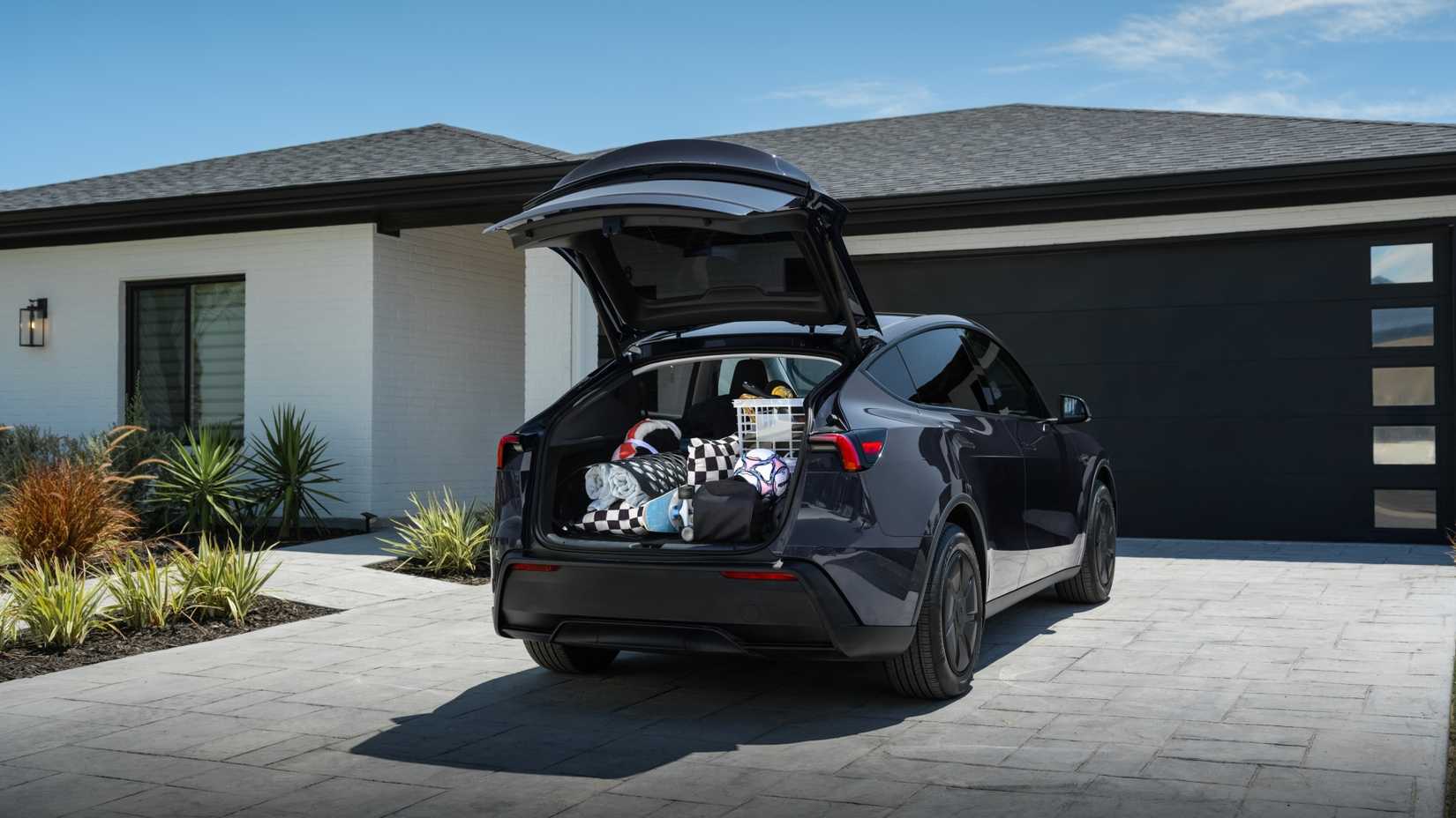 Tesla Model Y Standard parked with hatch open