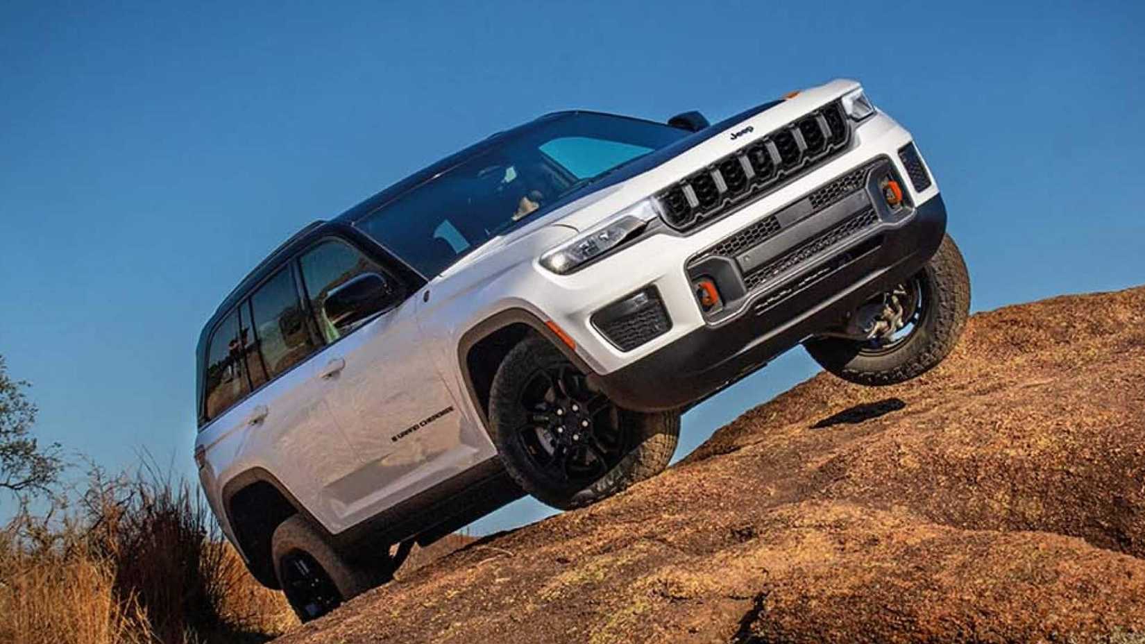 2026 Jeep Grand Cherokee on a rock off-roading
