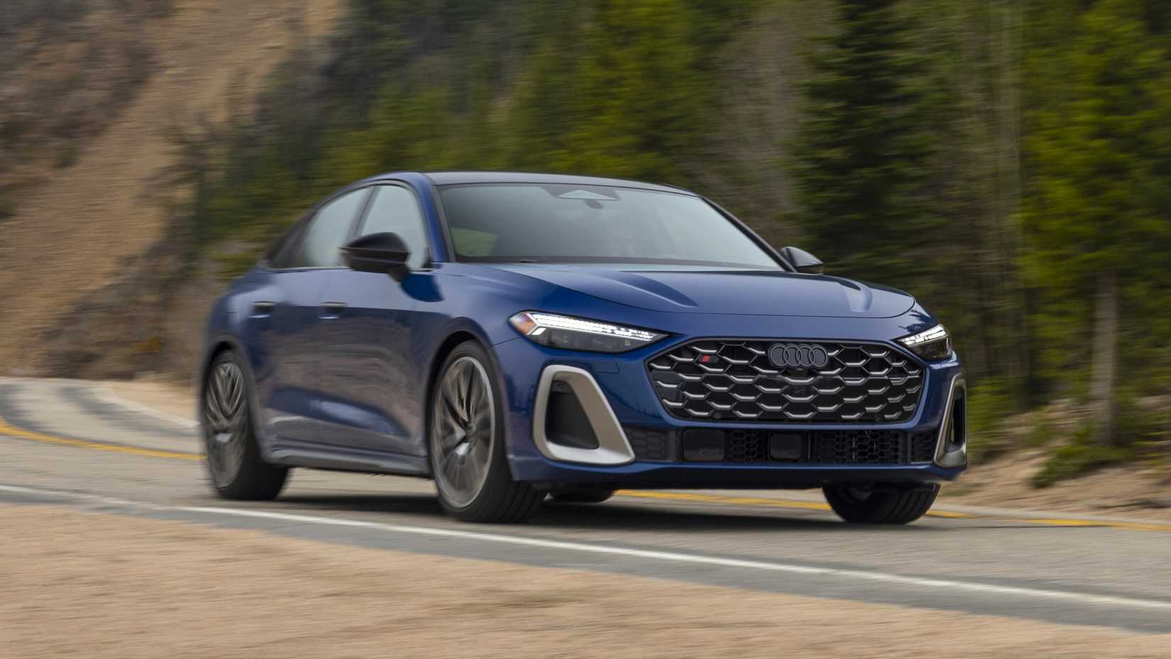 Front 3/4 shot of a 2025 Audi S5 accelerating down the road