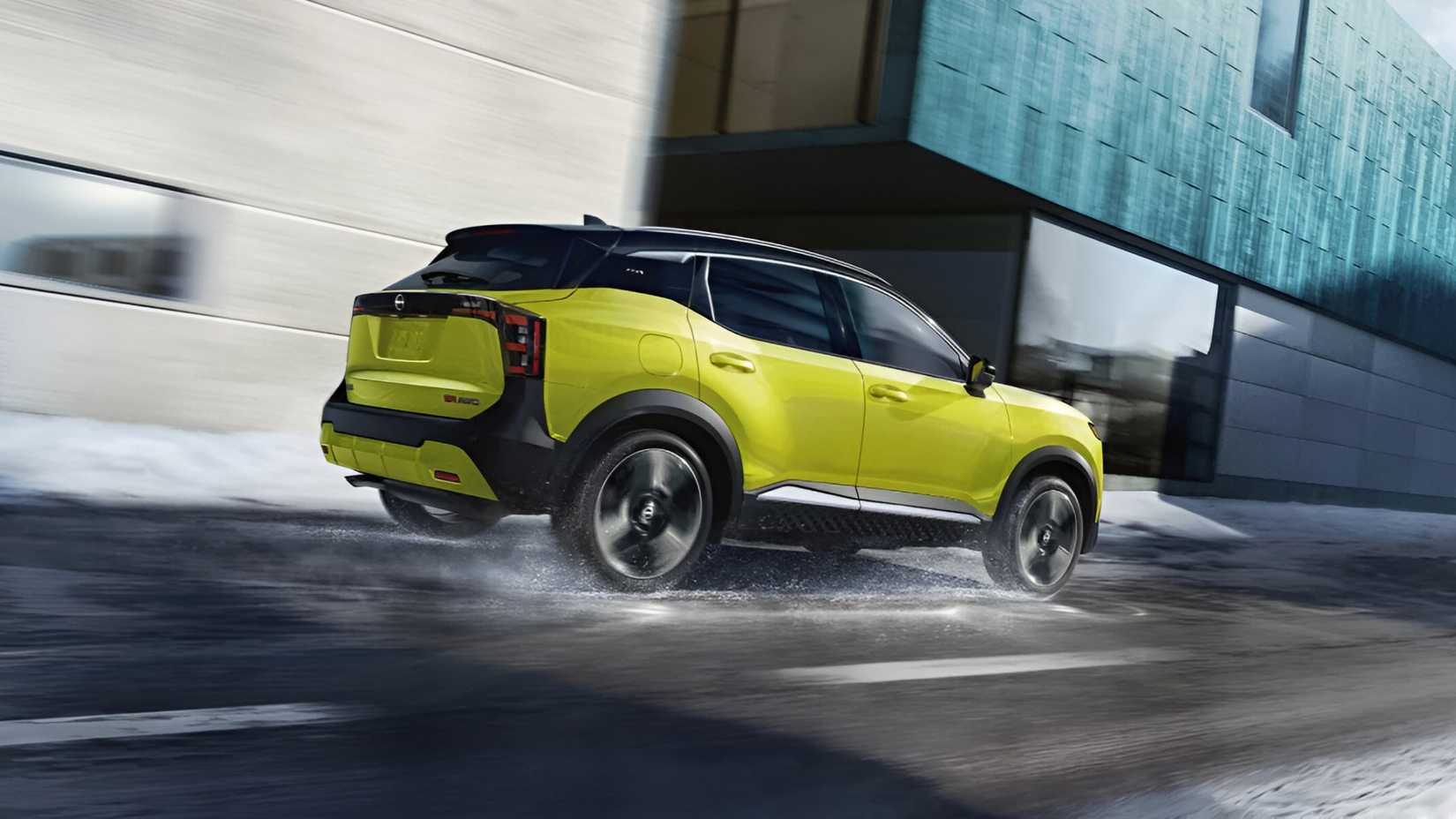 2026 Nissan Kicks in green accelerating rear third quarter view