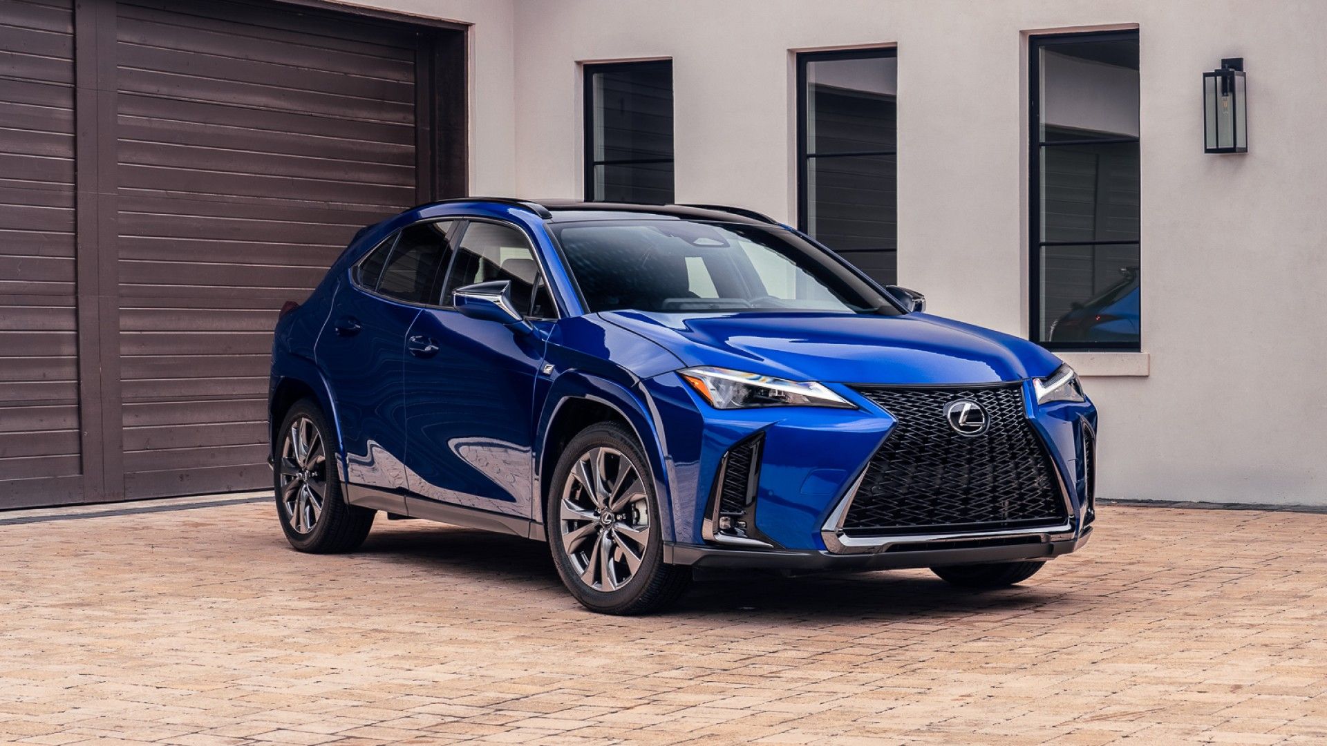 2026 Lexus UXh em vista frontal azul do terceiro quarto