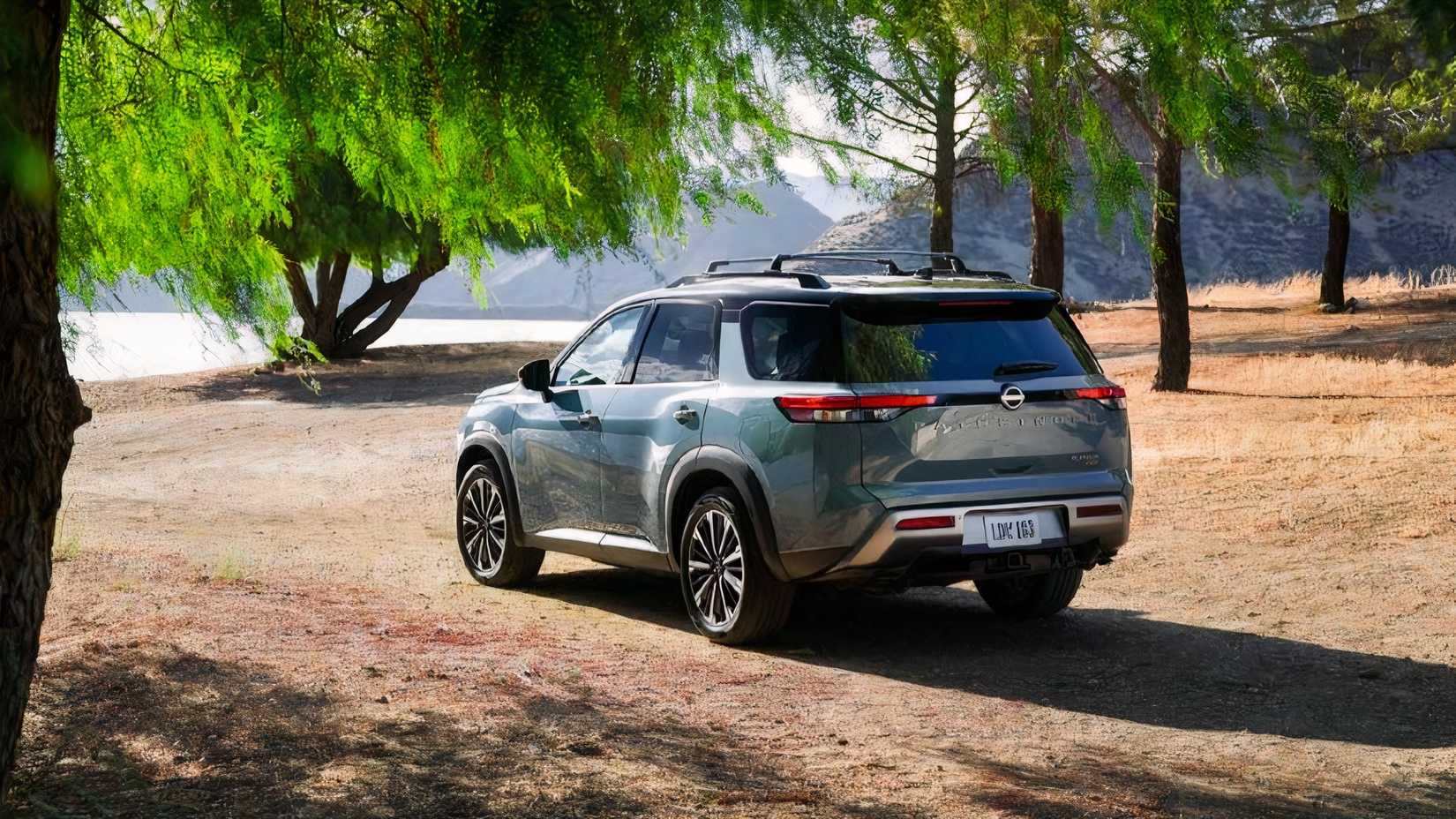 2026 Nissan Pathfinder Platinum rear 3/4 shot parked off-road