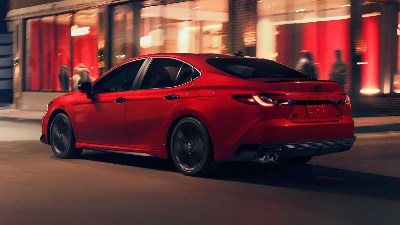 2026 Toyota Camry Hybrid rear third quarter accelerating view