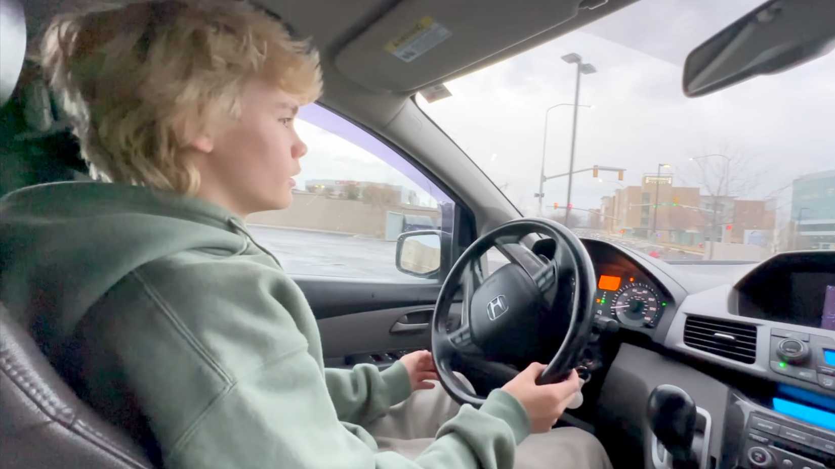 Teen driving a car