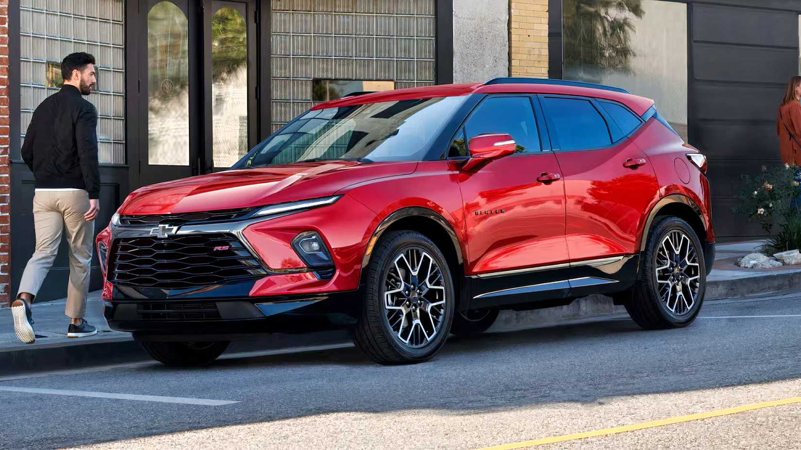 Front 3/4 shot of 2026 Chevrolet Blazer in red parked on road