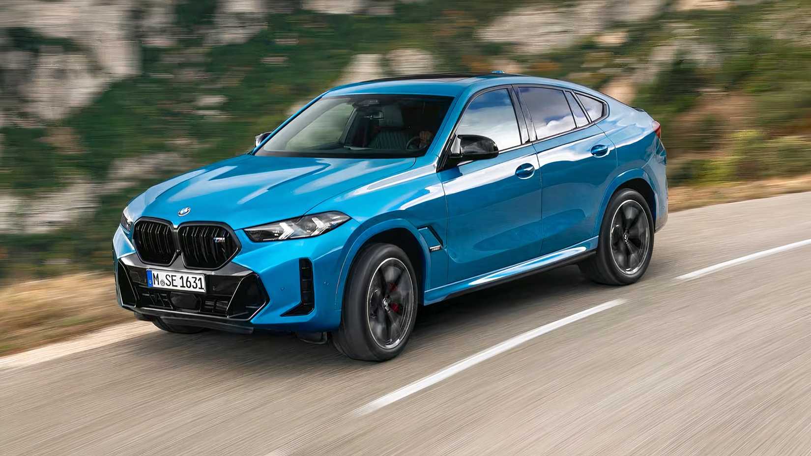 2025 BMW X6 M60i in blue being driven on road