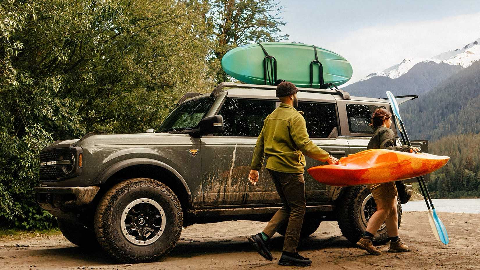 2026 Ford Bronco parked off-road with loaded roof rack