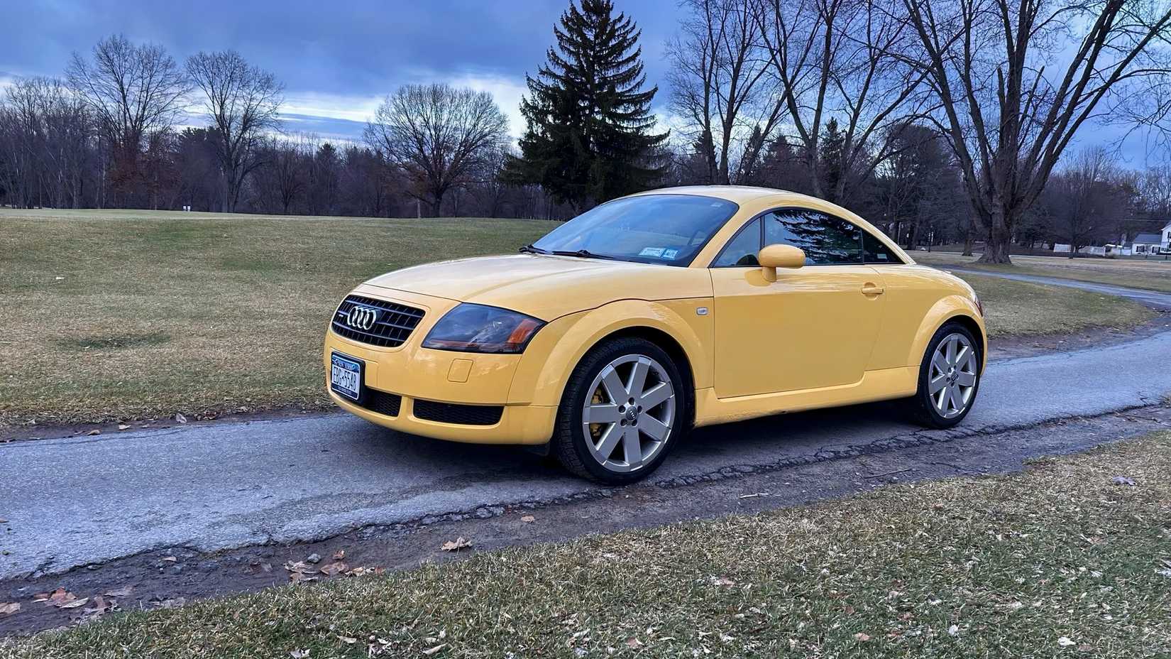 2004 Audi TT Quattro in yellow being driven