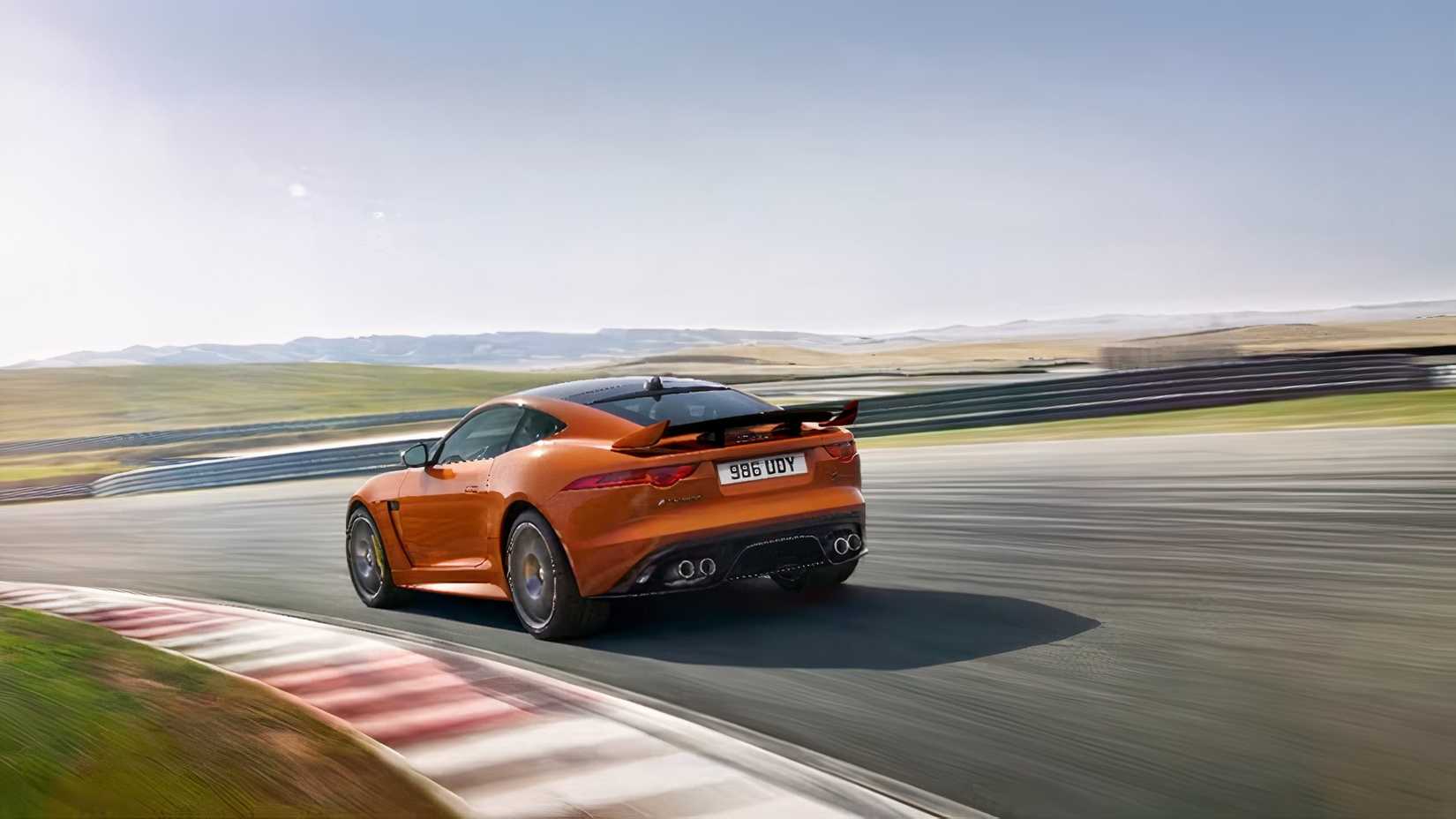 2019 Jaguar F-Type SVR in orange being driven on track