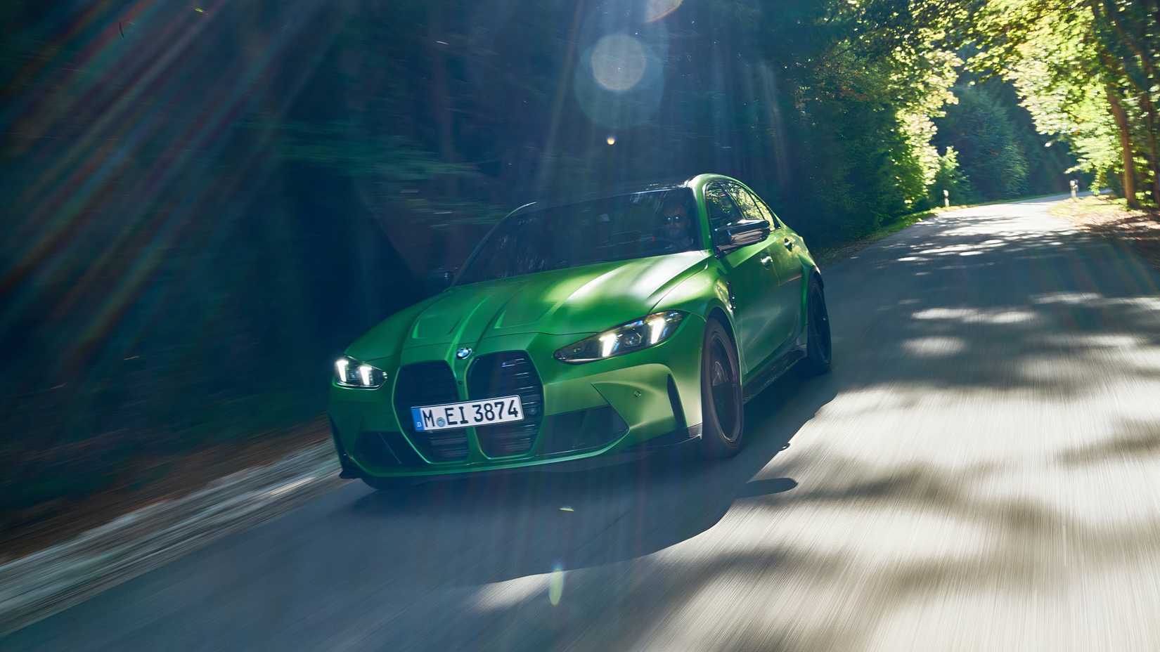 2025 BMW M3 Competition (European Model) in green being driven on road