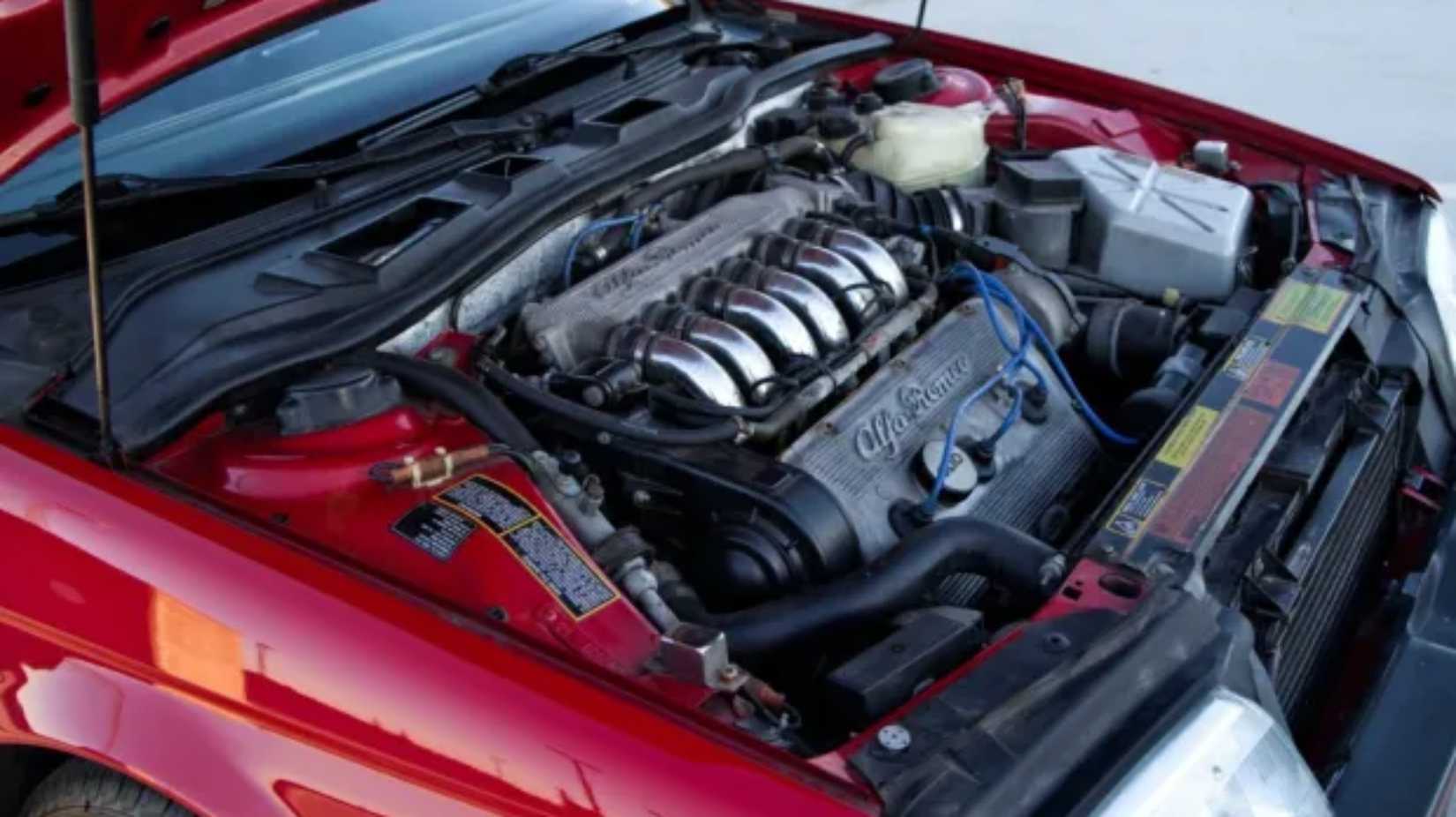 Shot of a red 1991 Alfa Romeo 164's engine