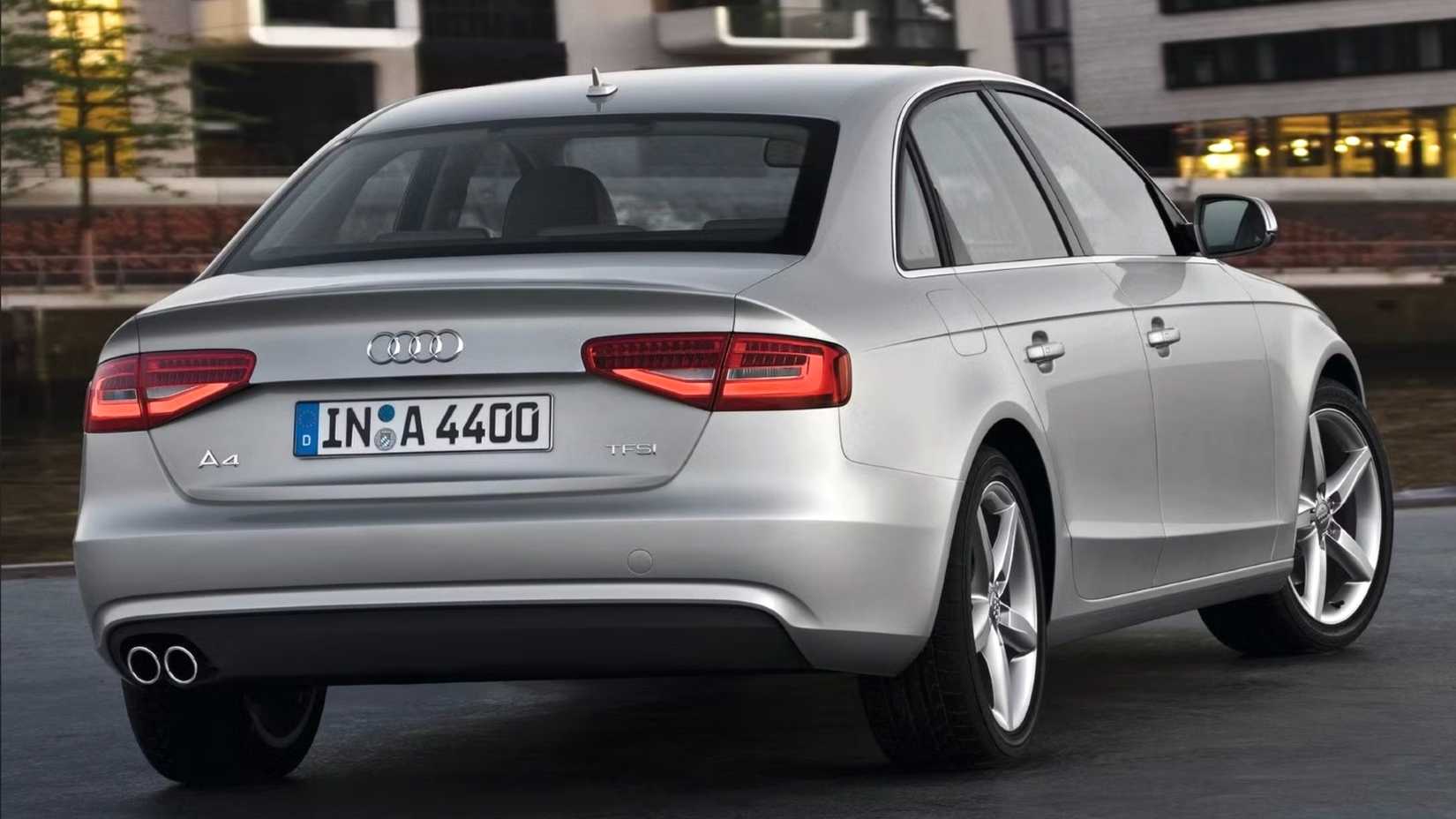 Rear three-quarters shot of a silver 2013 Audi A4
