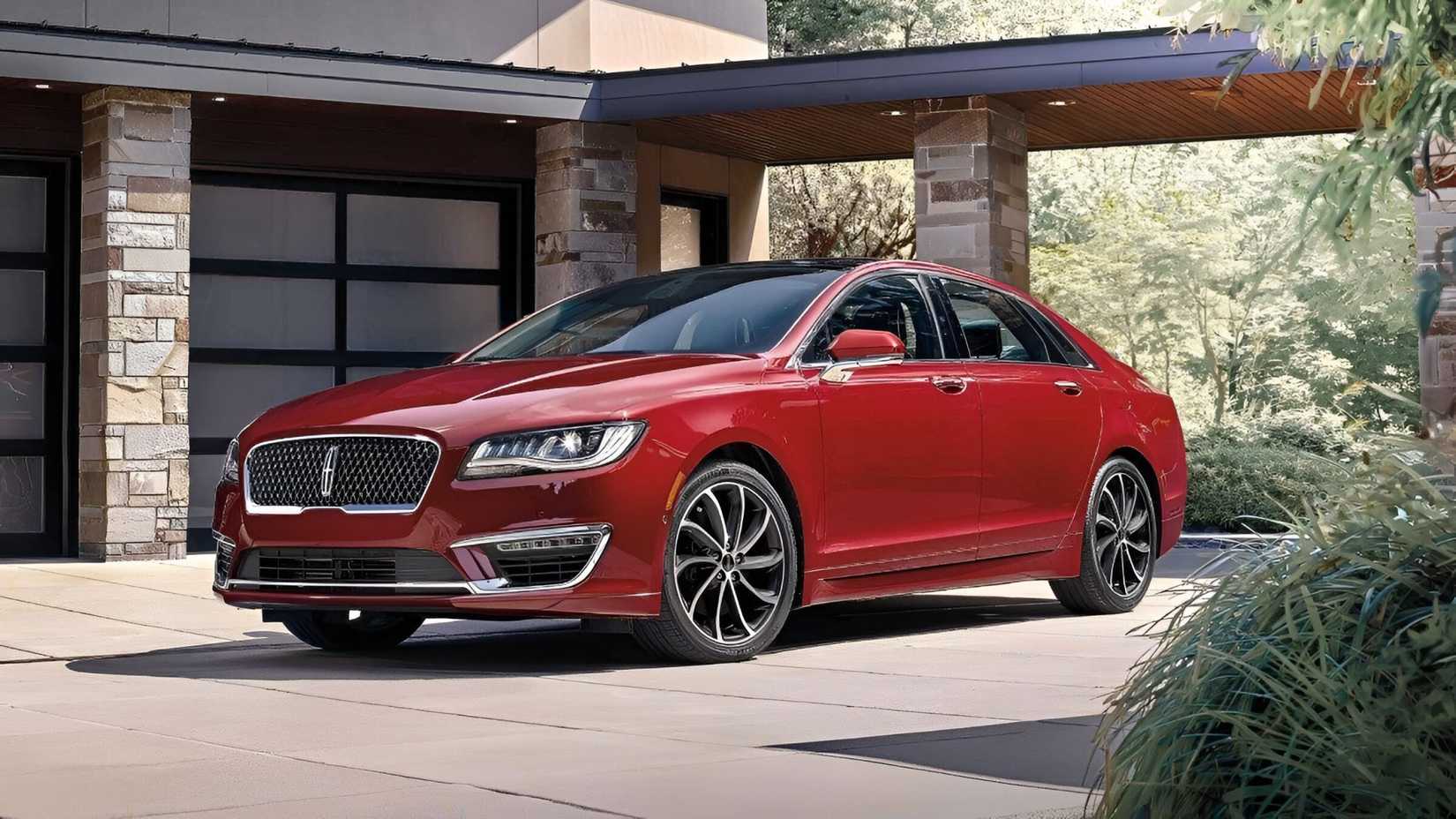 Front 3.4 shot of a 2020 Lincoln MKZ in red parked in front of house