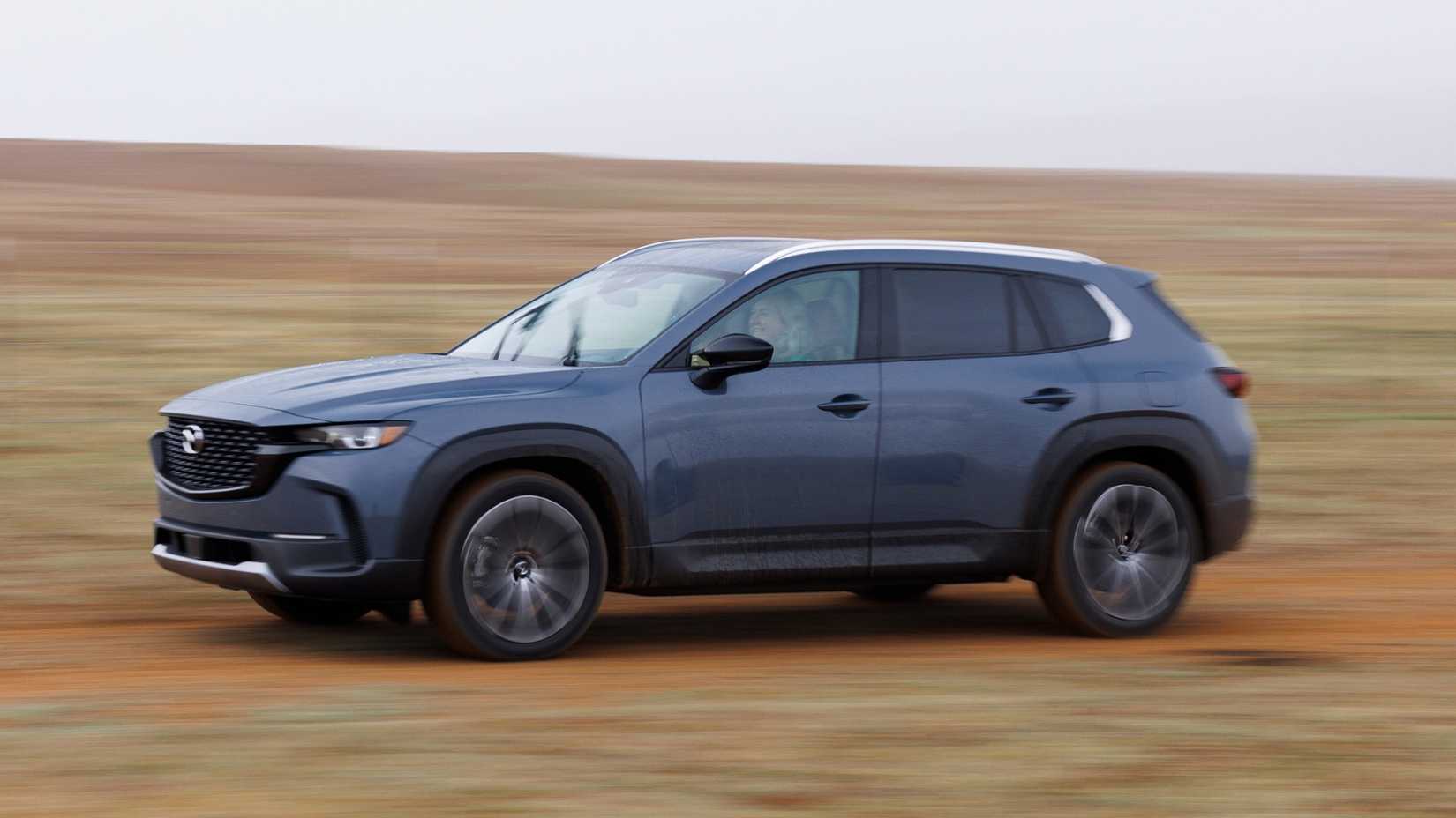 2026 Mazda CX-50 accelerating side profile view