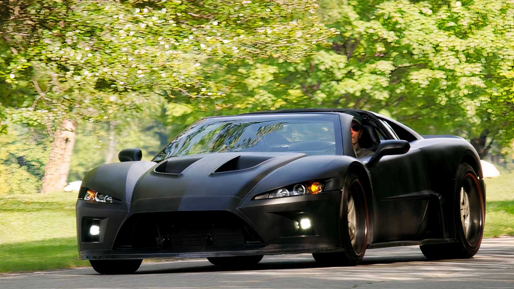 Falcon F7 in black being driven on road