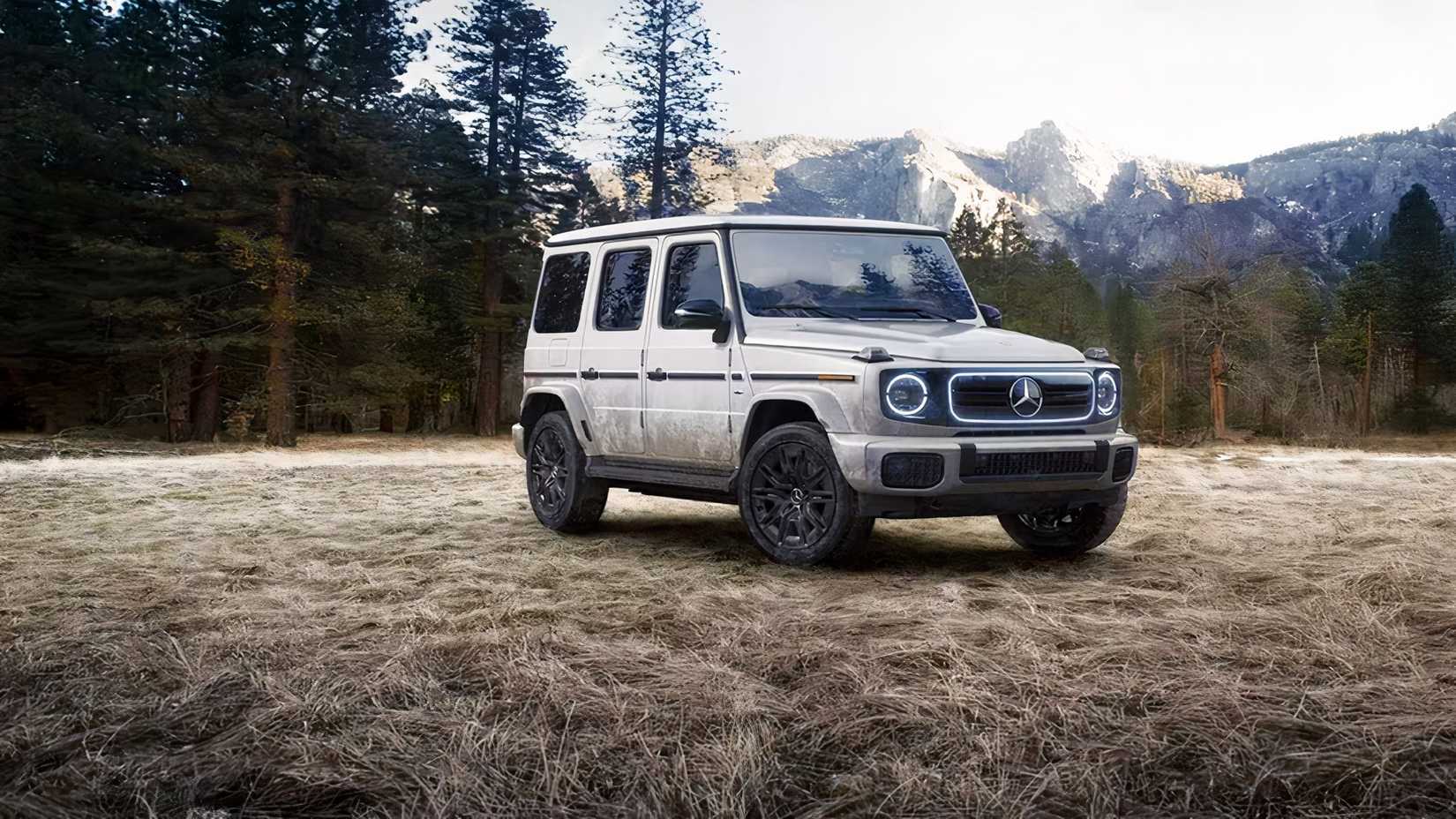 Front 3/4 shot of 2026 Mercedes-Benz G-Class in white parked