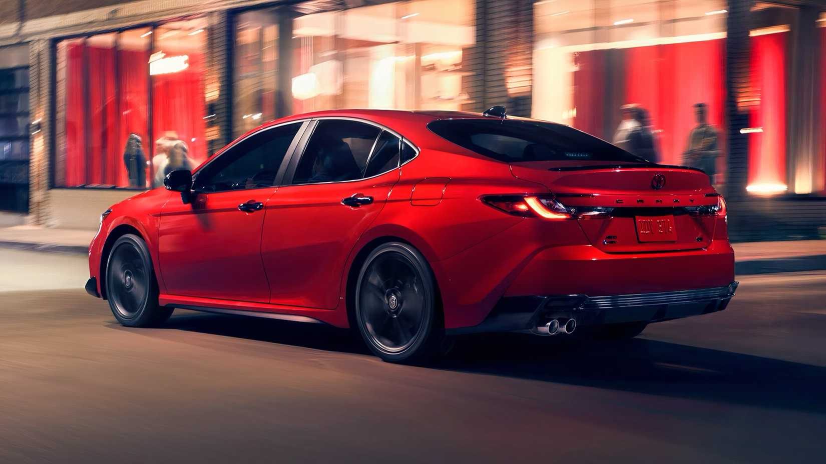 2026 Toyota Camry in red being driven