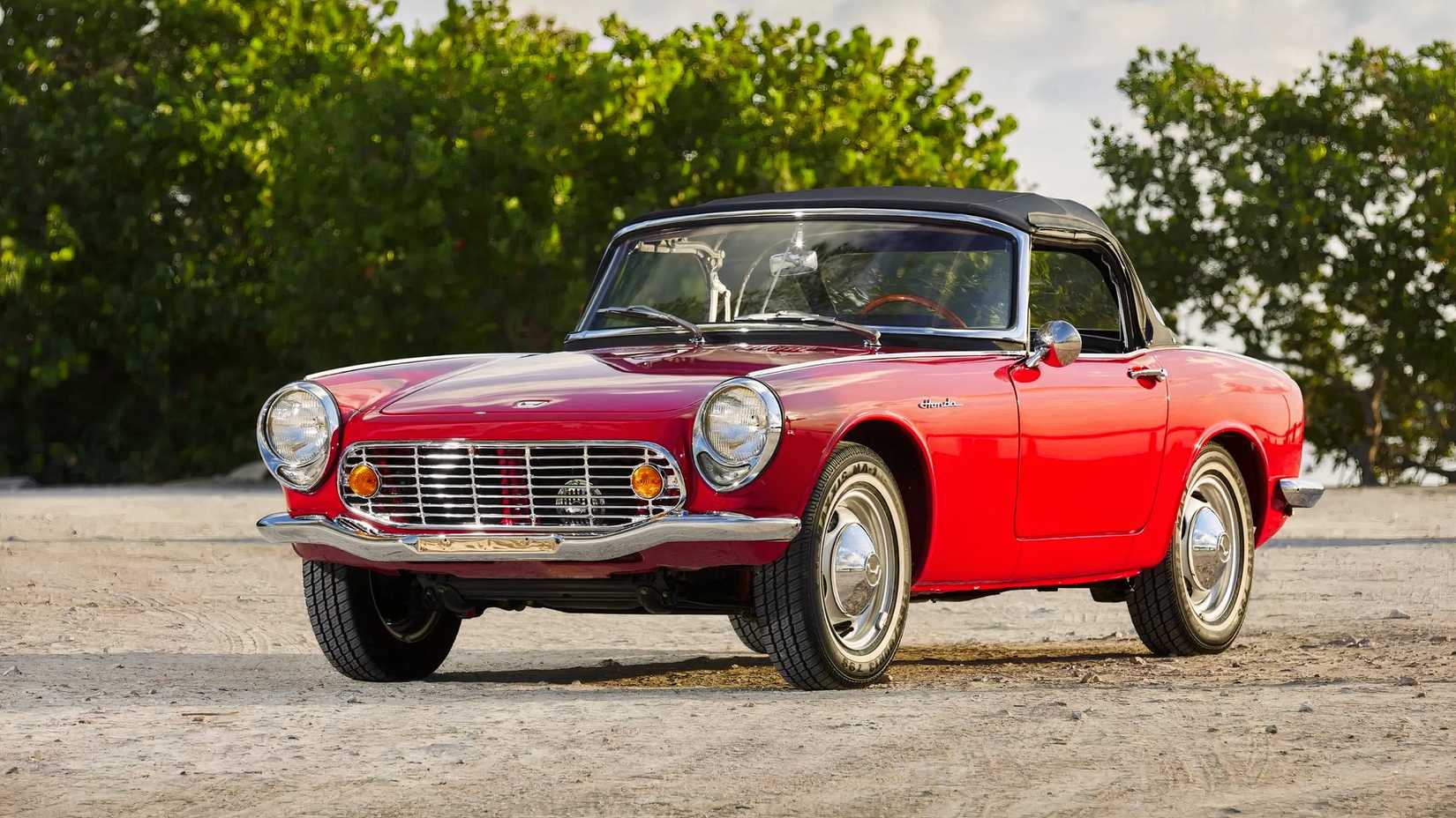 1965 Honda S600 in red parked on gravel road