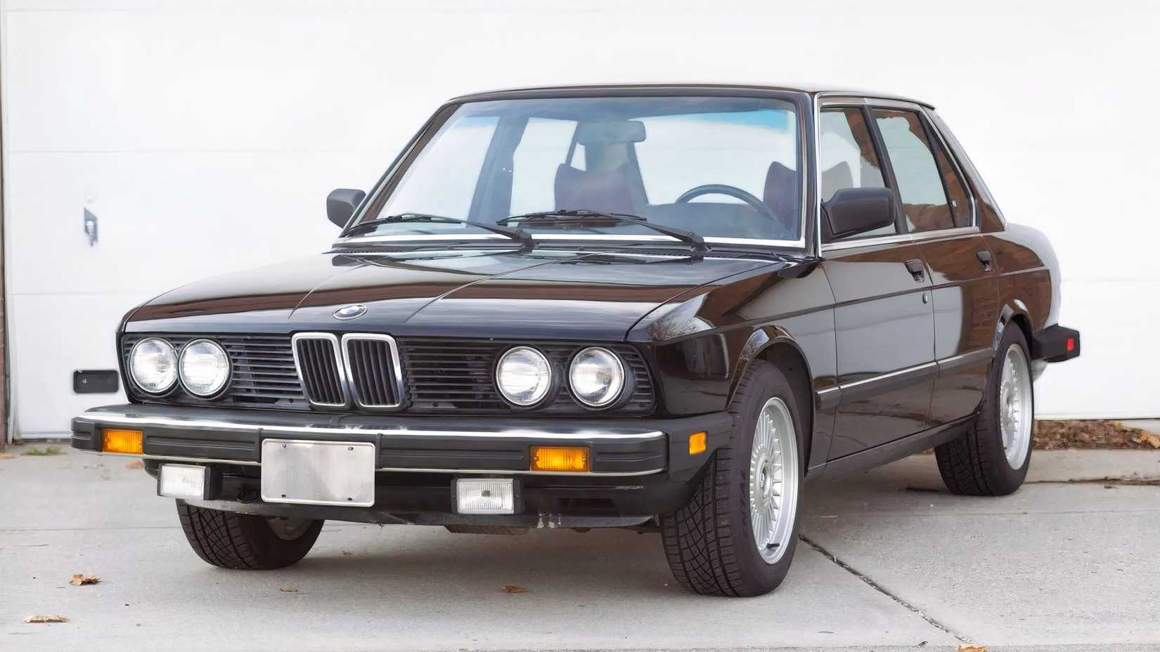 1984 BMW 533i in black parked