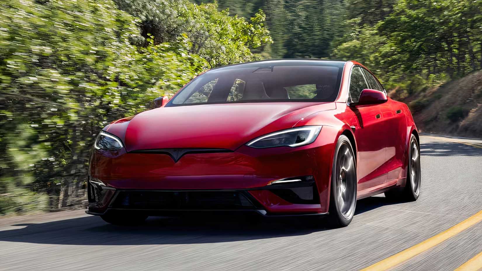 2026 Tesla Model S Plaid in red being driven on road
