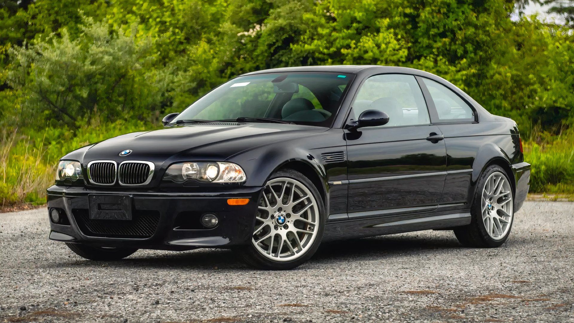 Front 3/4 shot of 2006 BMW M3 Competition in black parked