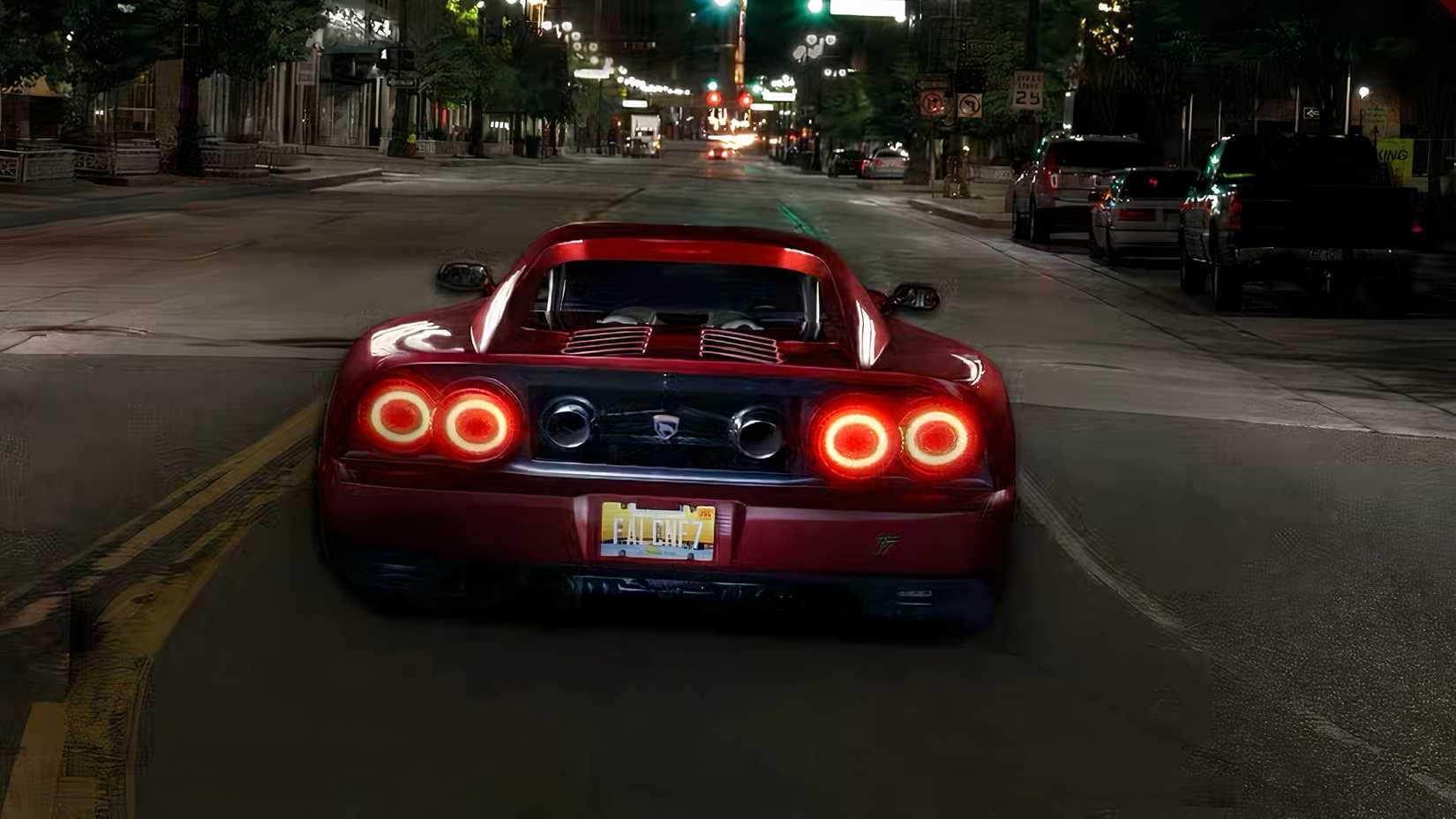 Falcon F7 in red being driven on road