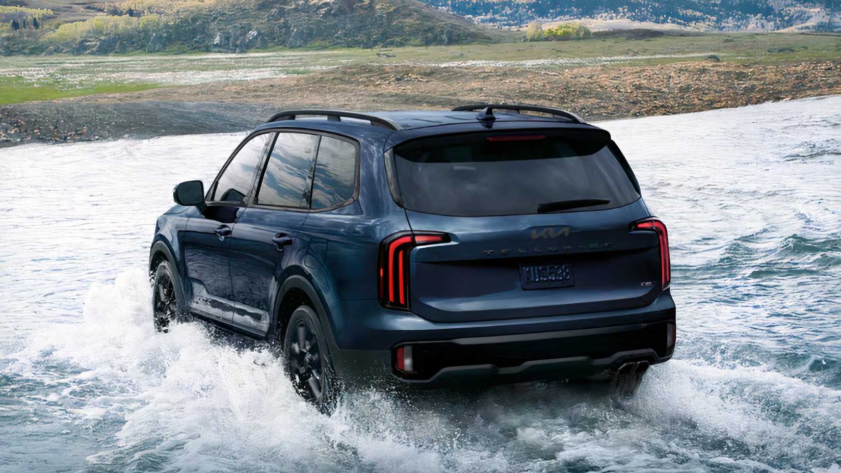 Rear 3/4 action shot of 2025 Kia Telluride being driven across stream