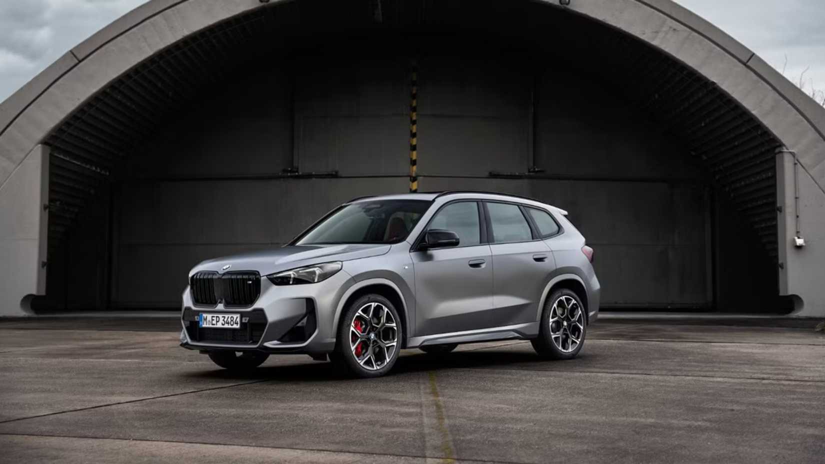2026 BMW X1 parked in front of a hanger