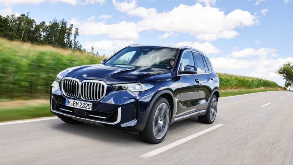 2026 BMW X5 front driving shot along rural environment