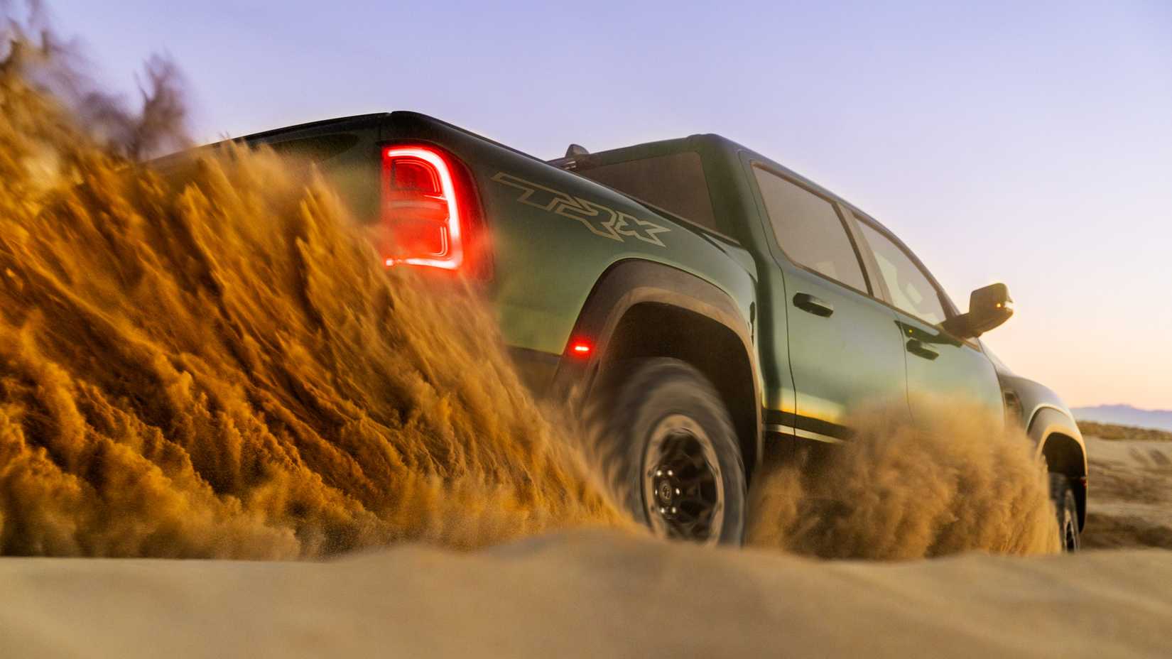An action shot of the 2027 Ram 1500 SRT TRX slinging sand