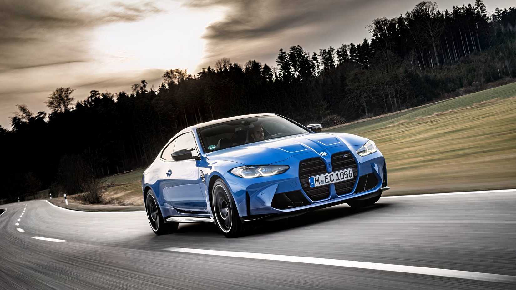 G82 BMW M4 Competition Coupe front 3/4 view dynamic driving shot