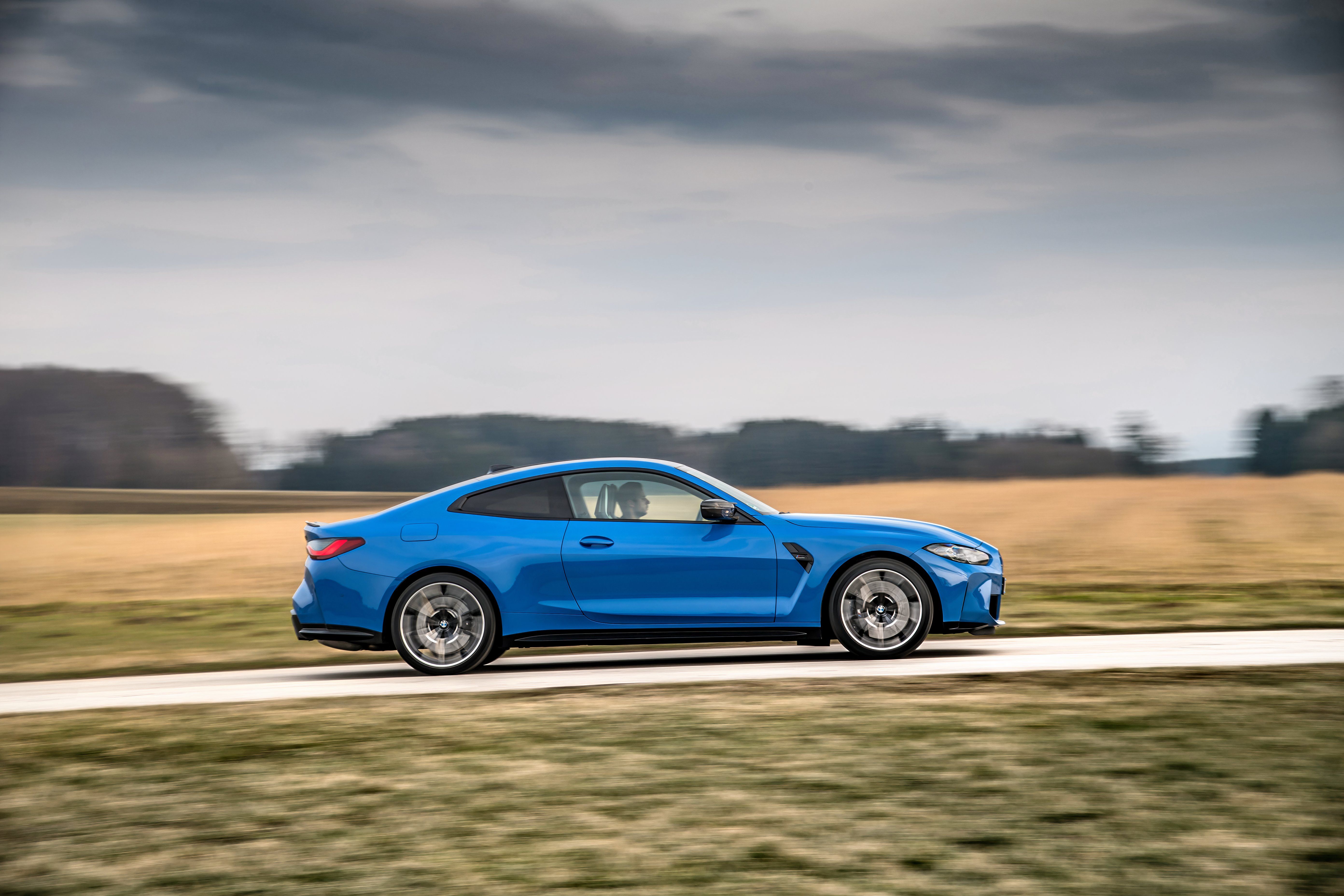 G82 BMW M4 Competition Coupe side driving view