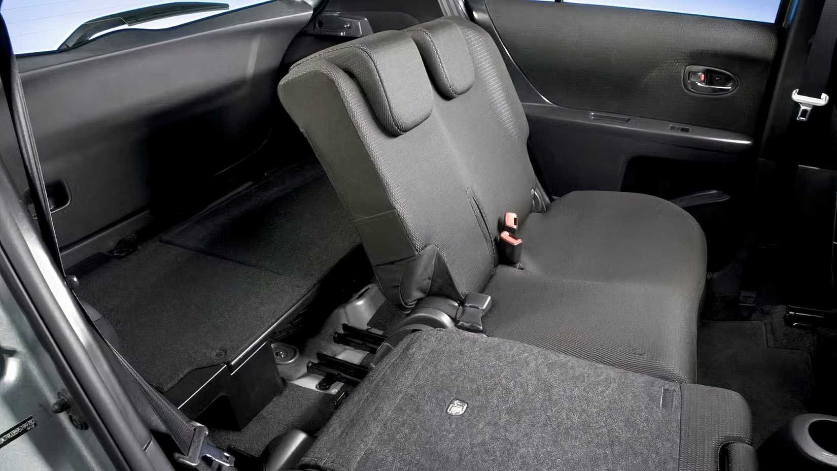 2009 Toyota Yaris Hatchback interior showing rear seats and trunk