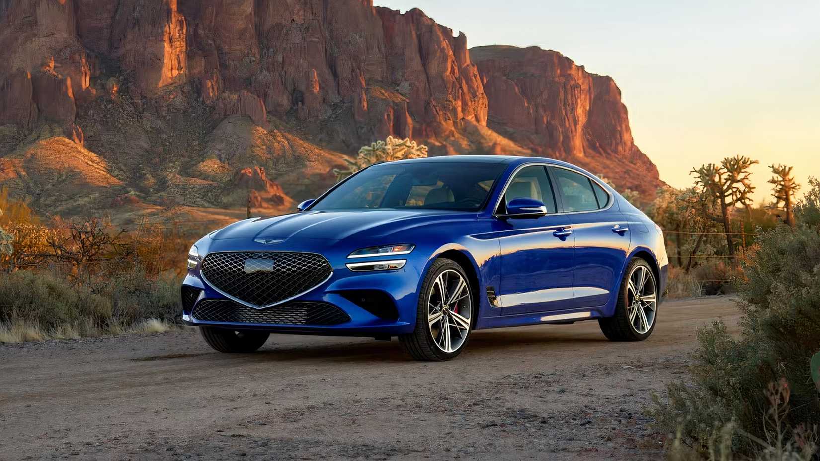 2026 Genesis G70 3.3T front 3/4 parked on dirt road