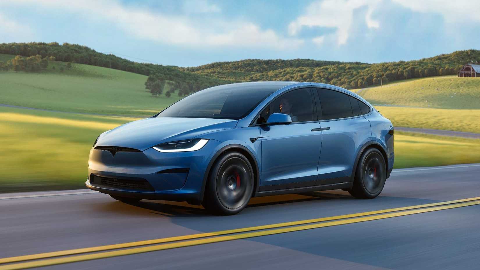 2026 Tesla Model X Plaid accelerating front third quarter view