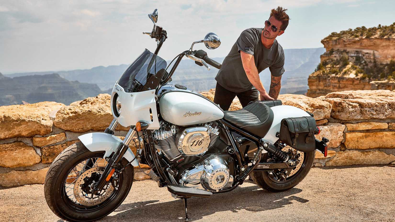 Rider next to an accessorized 2025 Indian Super Chief Limited