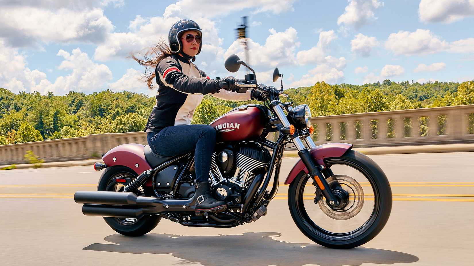 Rider on an Indian Chief accelerating, side profile view