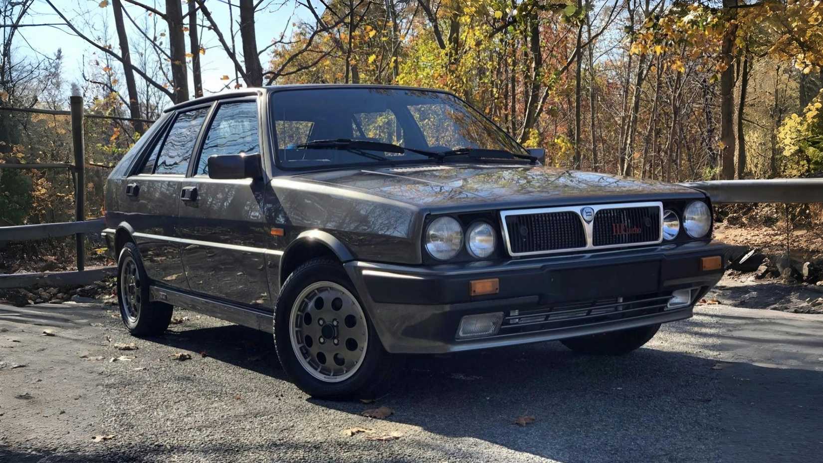 Lancia Delta HF Turbo in black front third quarter view